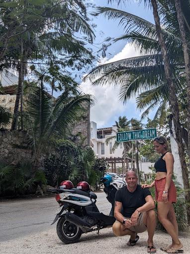 Customers riding in Tulum with their scooter